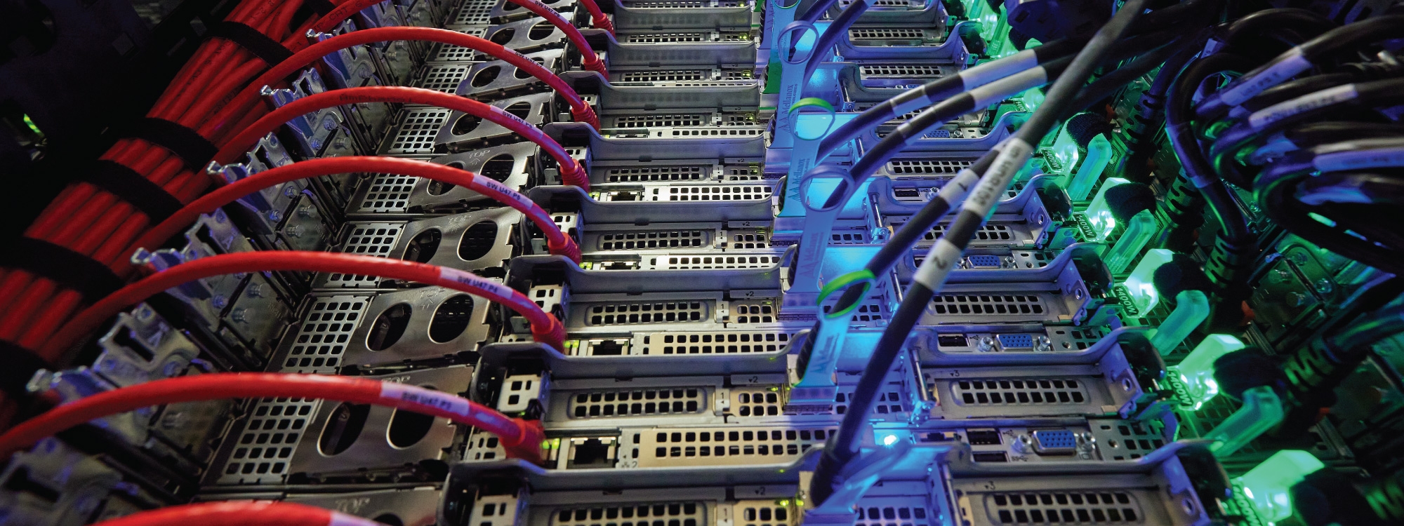 A series of cords and cables with blue and green lights.