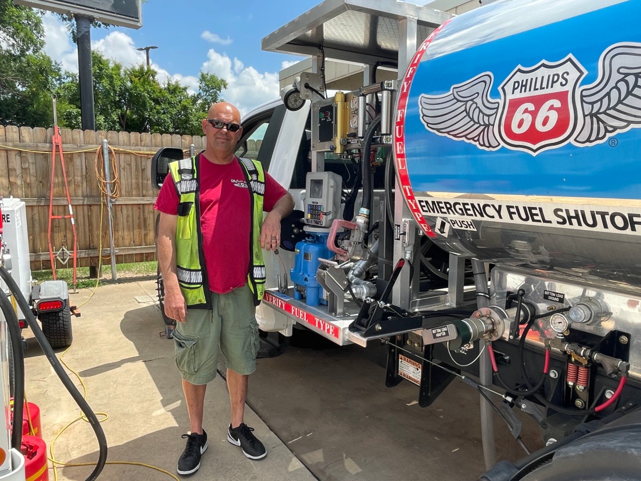 Cruise Aviation Lineman standing next to the Phillips 66 fuel truck operated by Cruise Aviation.