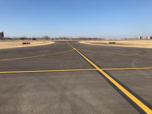 Airfield Intersecting taxiways, with a clear blue sky.