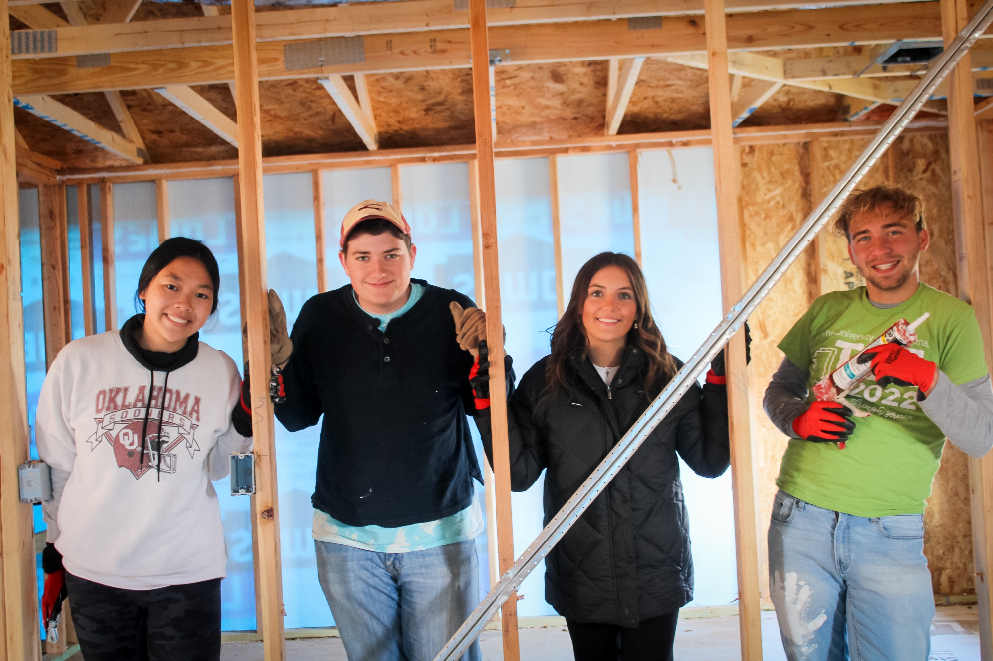 Students attending a fall leaf cleanup.