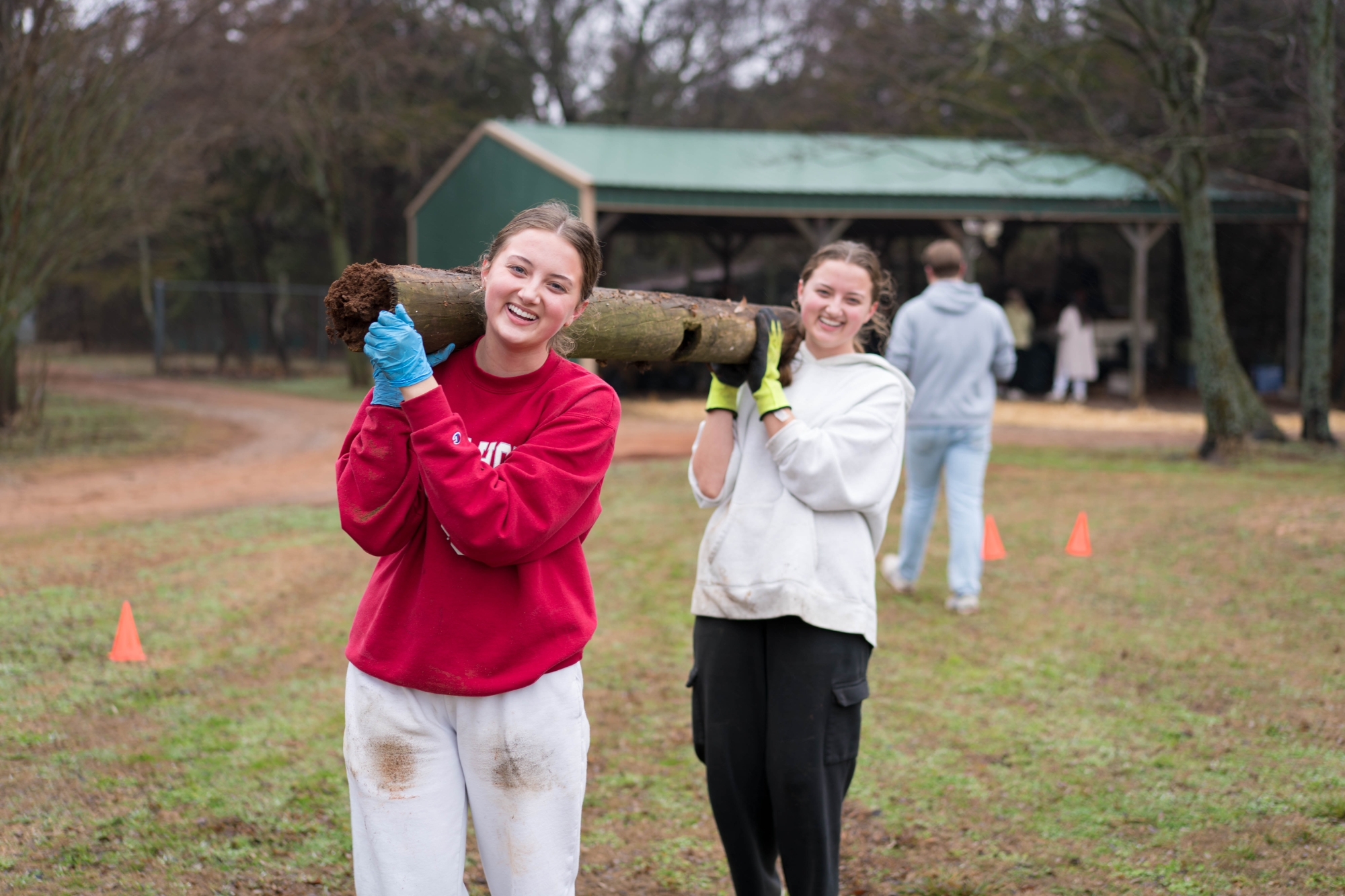 Three students pose for a photo at The Big Event.