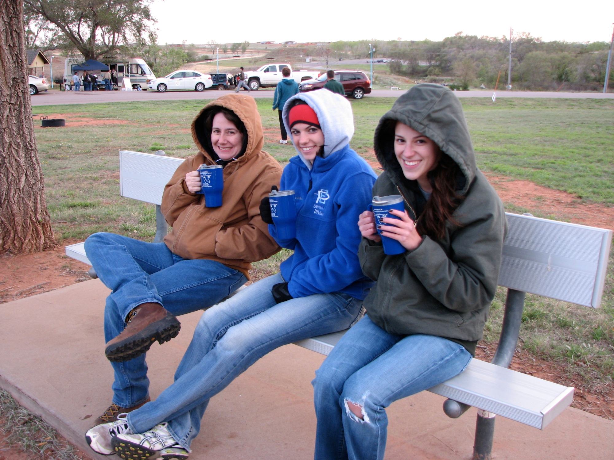 Students huddling with hot beverages during a cold BioBlitz