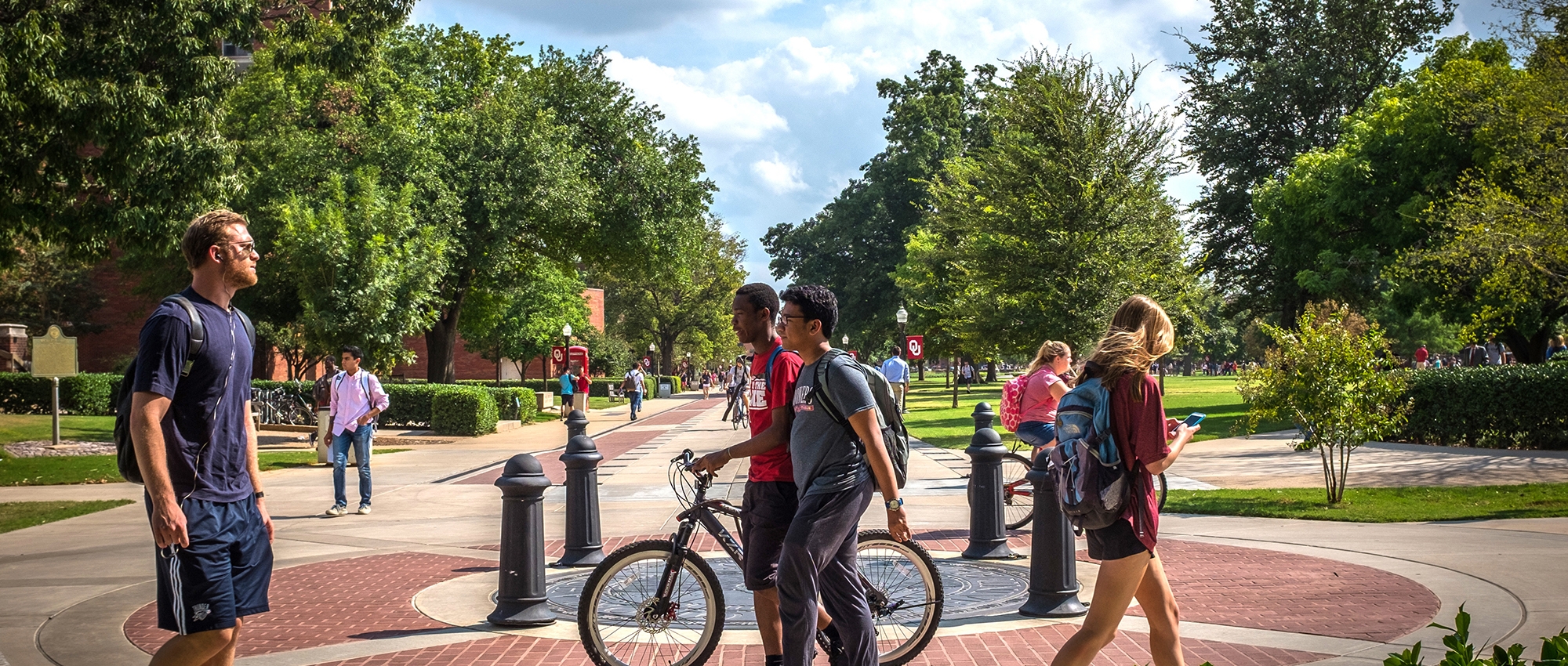 Students walking and biking on the University of Oklahoma Norman campus.