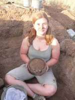 Shelbie Barlett with an excavated ceramic vessel, Mexico