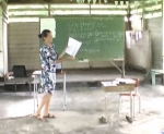instructor in front of blackboard