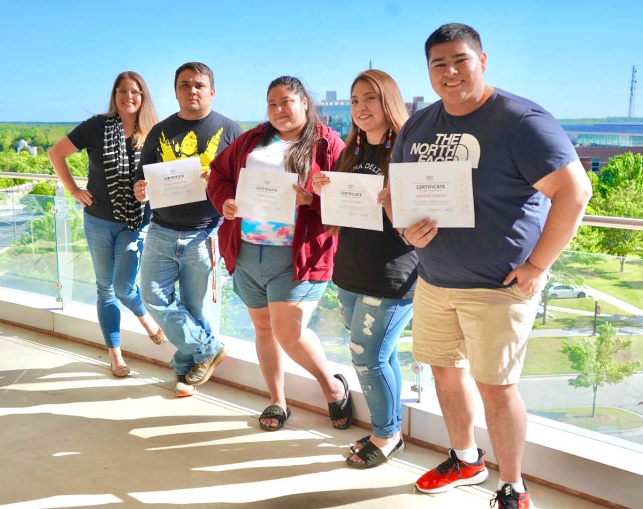 Dr. Jessica Blanchard, Co-Director of the Genomics and Ethics Program for Native Students, presents certificates of achievement to the 2020-2021 GEN Fellows