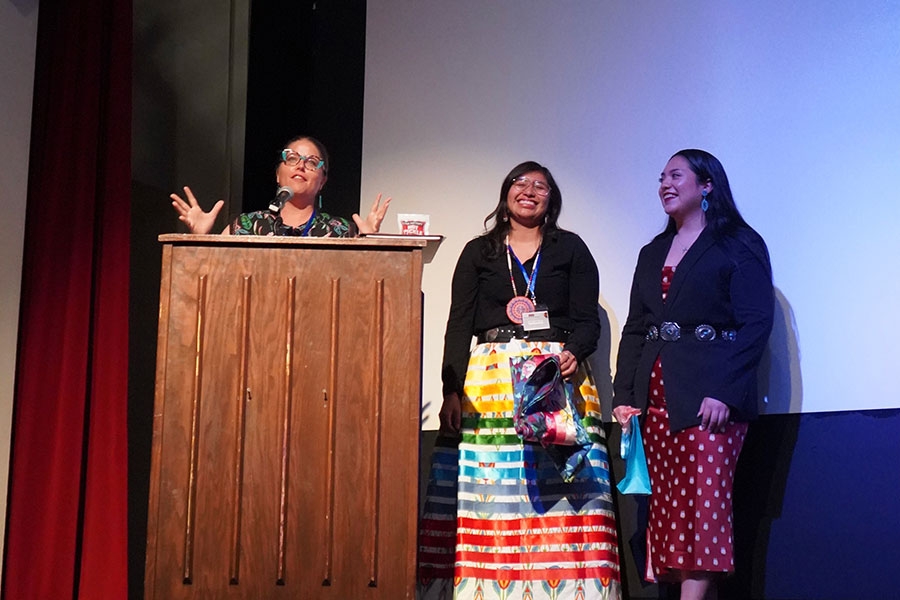 Jessica Blanchard, Sadie Littlecreek, and Julia Guerrero thanking those in attendance at IndiGENcon 2023. 