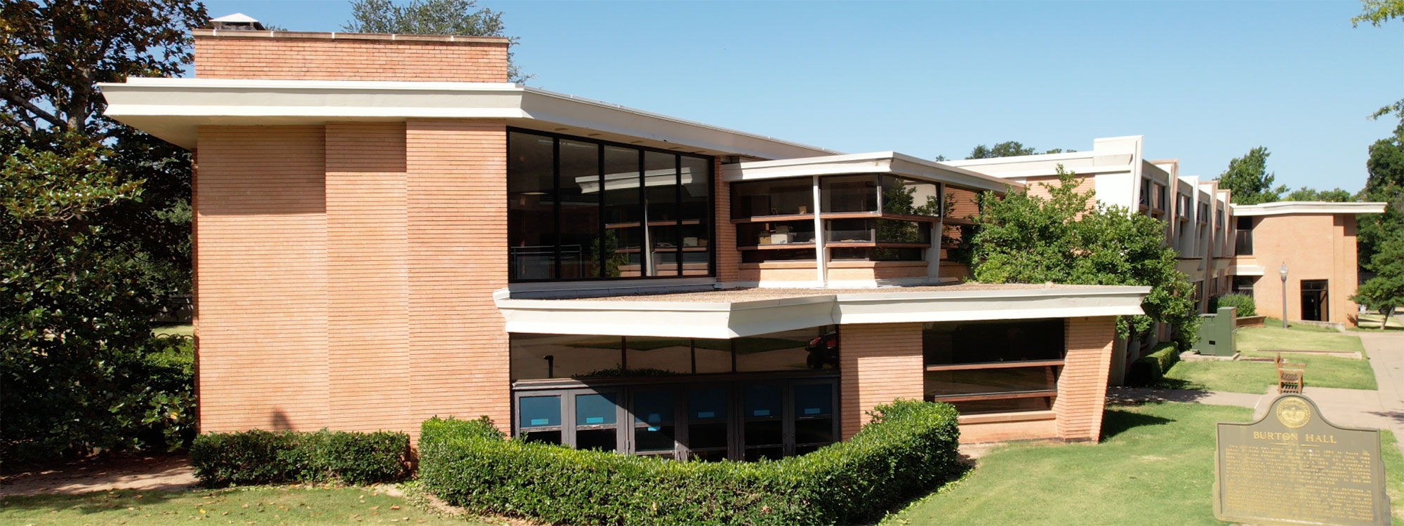 Exterior of Burton Hall and surrounding building in the back. 