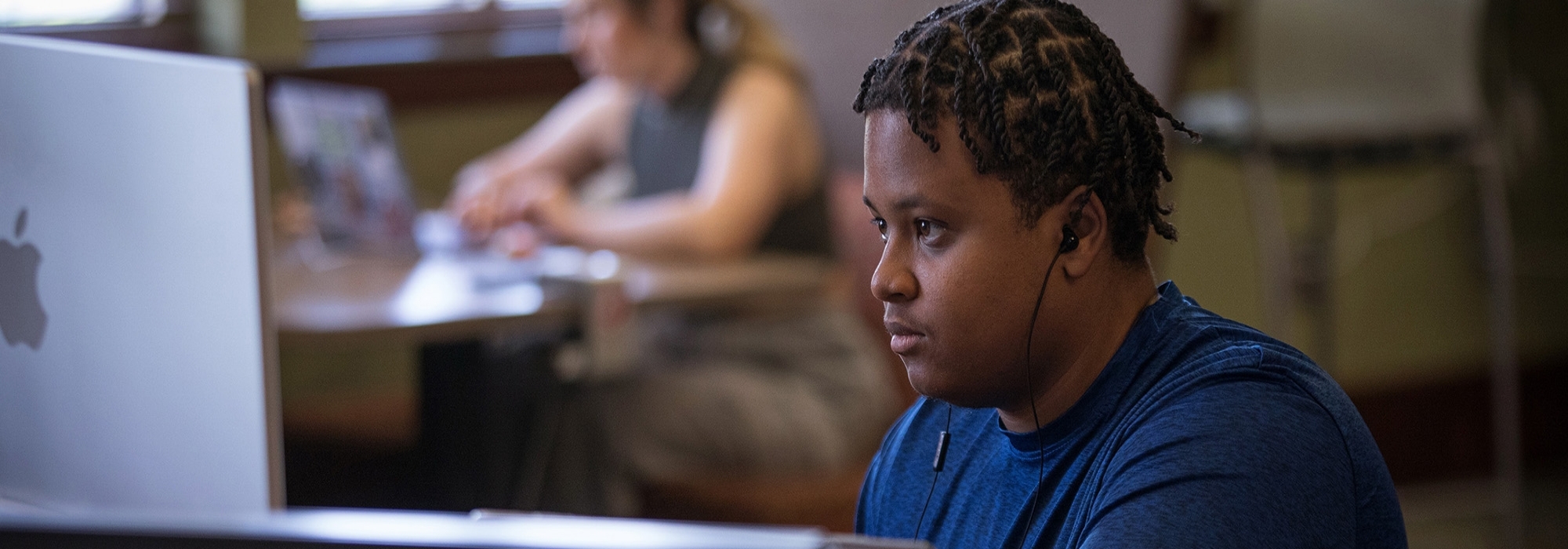 Student on desktop computer.