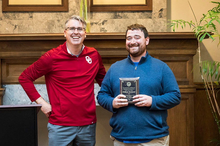 Dr. Burge presenting an award to Bill Townsend. 