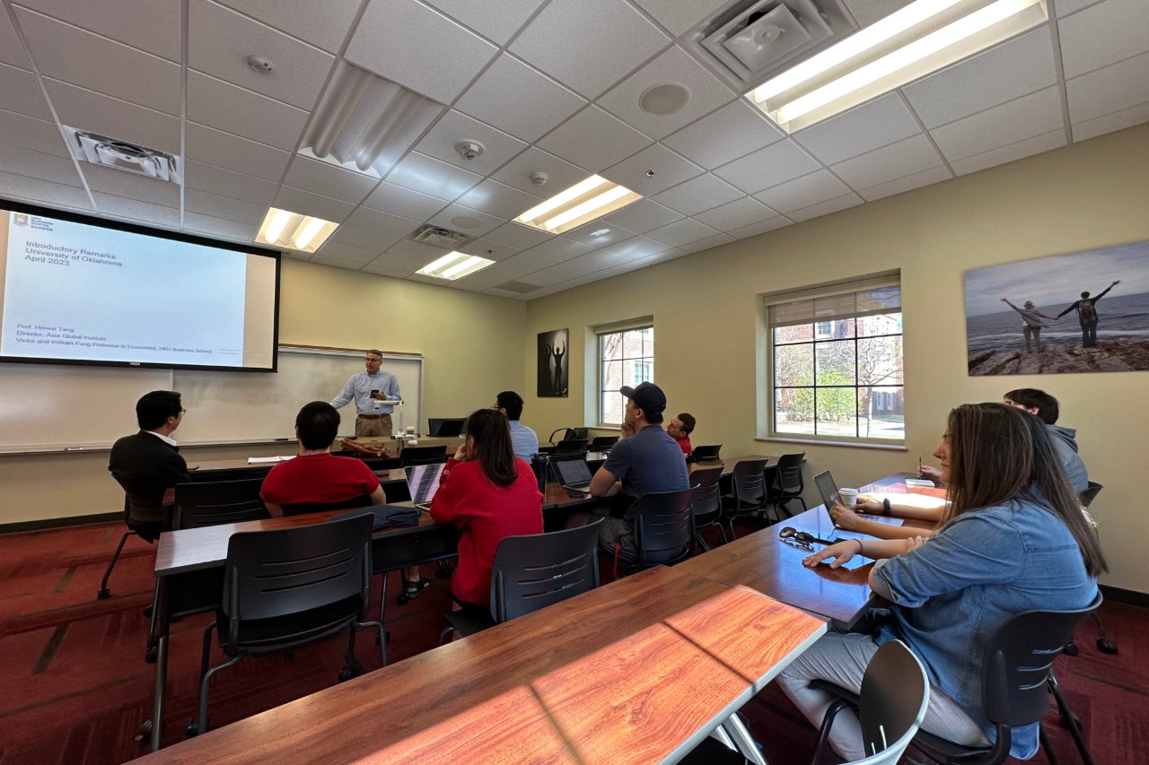 Dr. Burge speaking in front of a group of grad students. 
