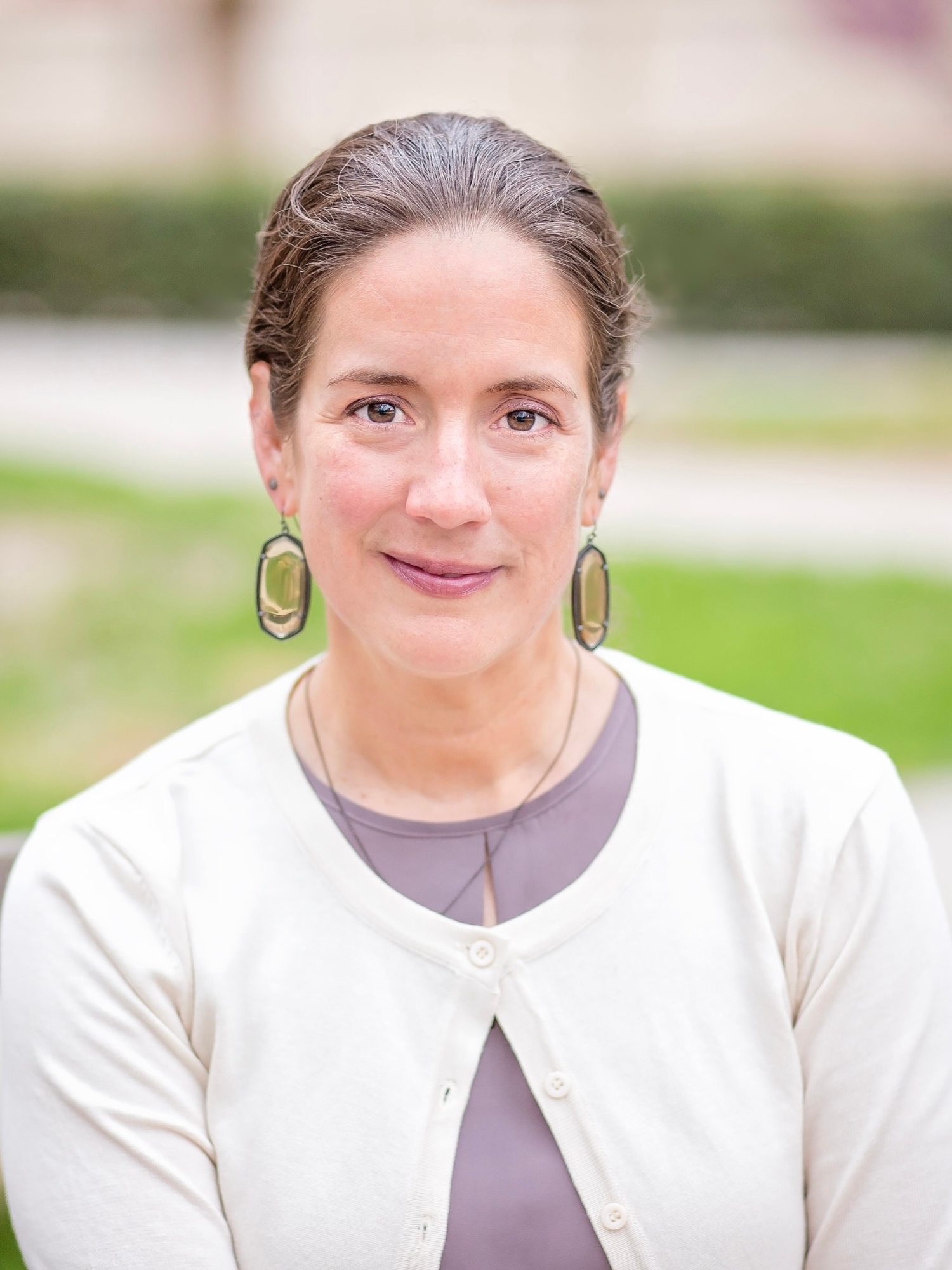Rachel C. Jackson, facing the camera while sitting outside