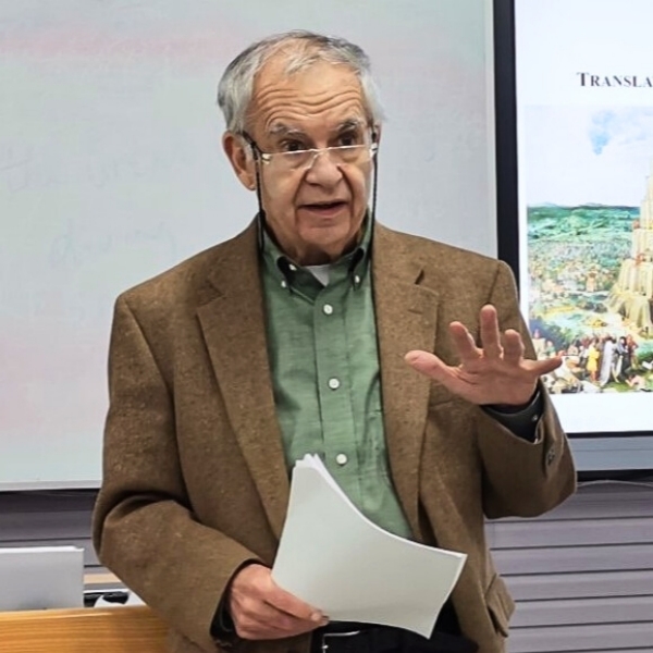 Photo of Ronald Schleifer standing at a podium