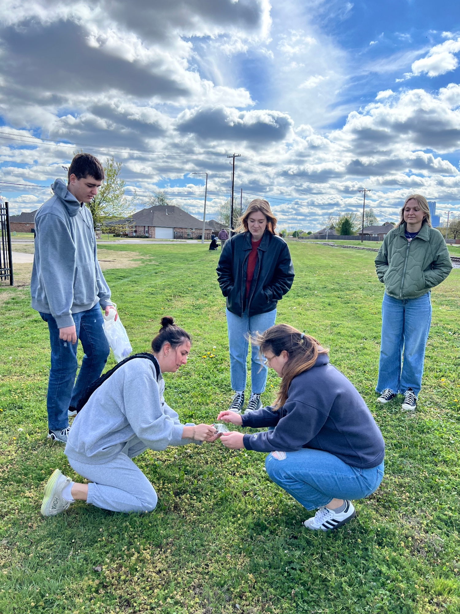 A group of students performs soil tests