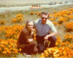 Corliss & Esther Livesey Photograph of Corliss & Esther Livesey in a field of orange flowers