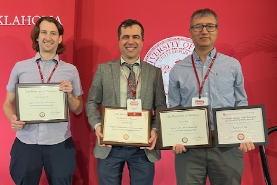 John Stupak, Mukremin Kilic, and Xinyu Dai with their framed awards
