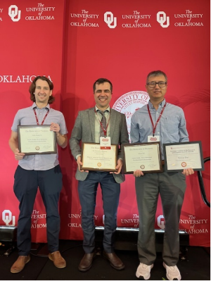 Stupak, Kilic, and Dai standing with their faculty awards