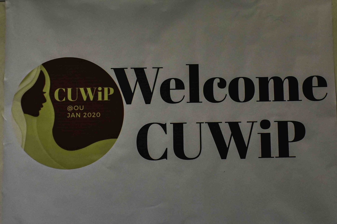 Welcome sign at the CUWiP conference. It has the CUWiP logo and says, "Welcome CUWiP".