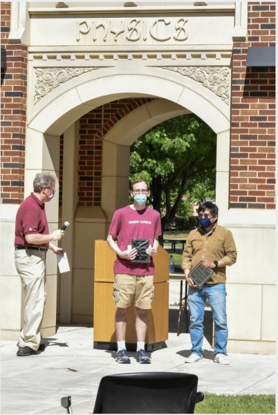 A photo of William McNulty accepting their award.