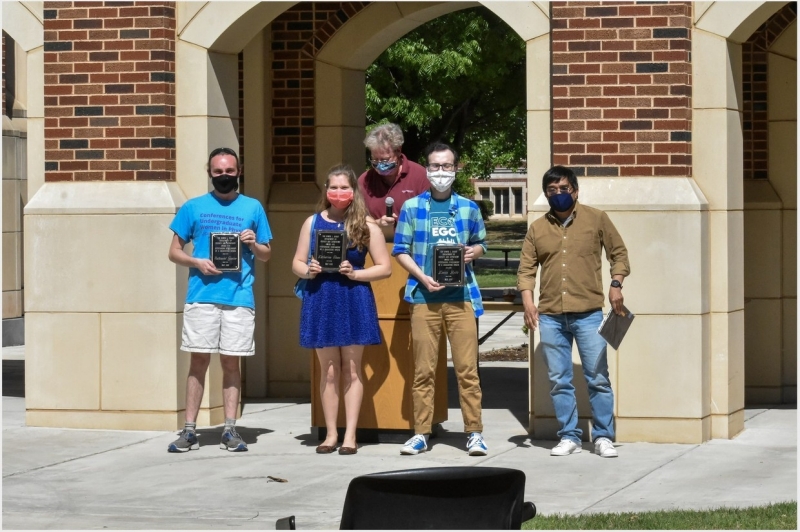 Nathaniel Gunter, Katherine Sloan, and Kevin Robb accept their awards.