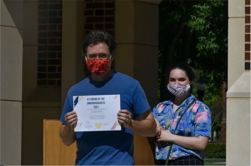 A photo of Brad Abbott accepting his award.