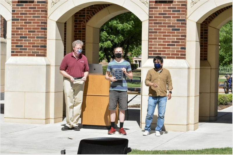 A photo of Tanner Legvold accepting their award.