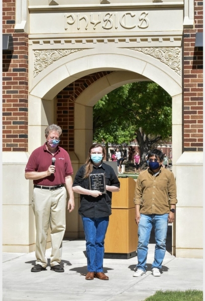 A photo of J. Alexander Yates accepting their award.