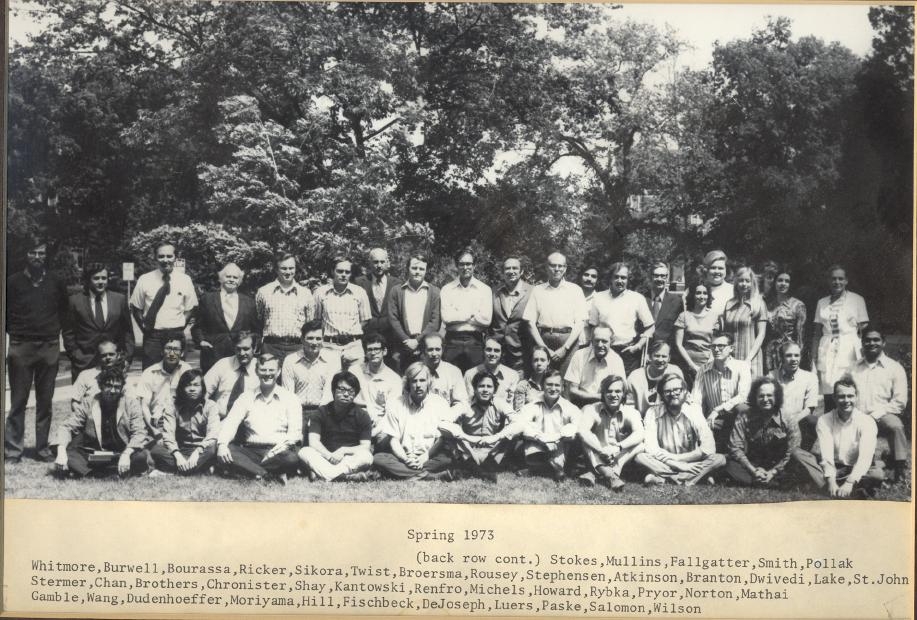 1972-1973 group photo in black and white. Text under photo: "Spring 1973 [First line] (back row cont.) Stokes, Mullins, Fallgatter, Smith, Pollak, [Second line] Whitmore, Burwell, Bourassa, Ricker, Sikora, Twist, Broersma, Rousey, Stphensen, Atkinson, Branton, Dwivedi, Lake, St. John, [Third line] Stermer, Chan, Brothers, Chronister, Shay, Kantowski, Renfro, Michels, Howard, Rybka, Pryor, Norton, Mathai, [Fourth line] Gamble, Wang, Dudenhoeffer, Moriyama, Hill, Fischbeck, DeJoseph, Luers, Paske, Salomon, Wilson."