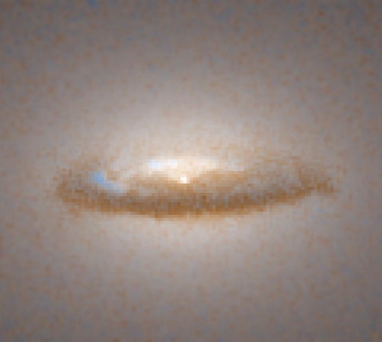 An image of the dust disk that has formed around the black hole in galaxy NGC 7052.