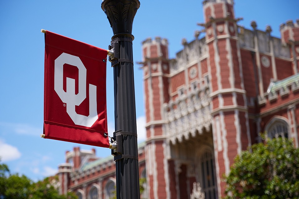 OU flag in front of the Bizzell Memorial Library.