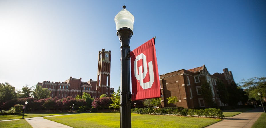 OU banner in forefront in front of Bizzell Library.