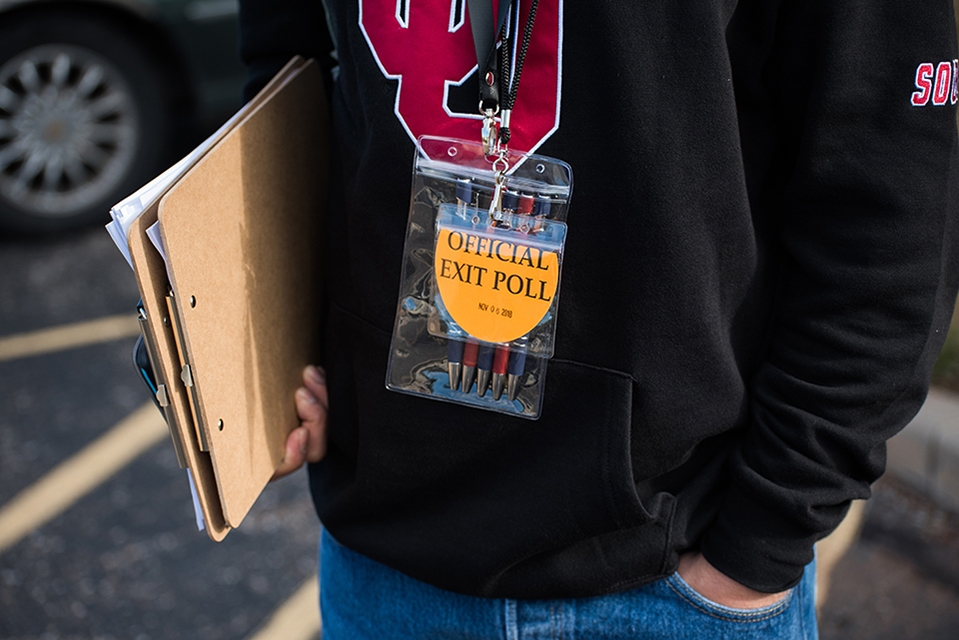 OU student with Exit Poll lanyard.