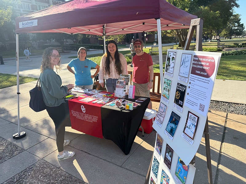 OU Librarians outside hosting Banned Books Week booth.
