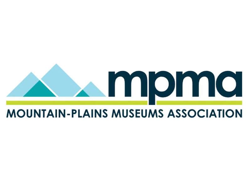 blue stylized mountains with the lettering mpma mountain-plains museum association.