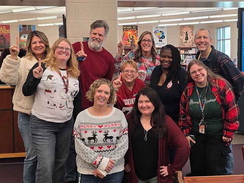 A view of an OU lamposted framed by the walkway in front of Bizzell Library.