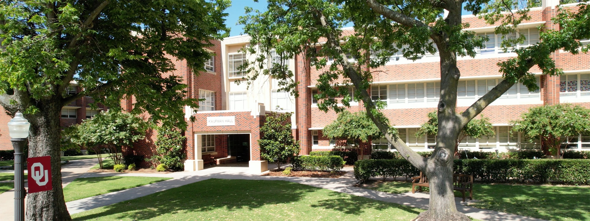 Kaufman Hall surrounded by trees.