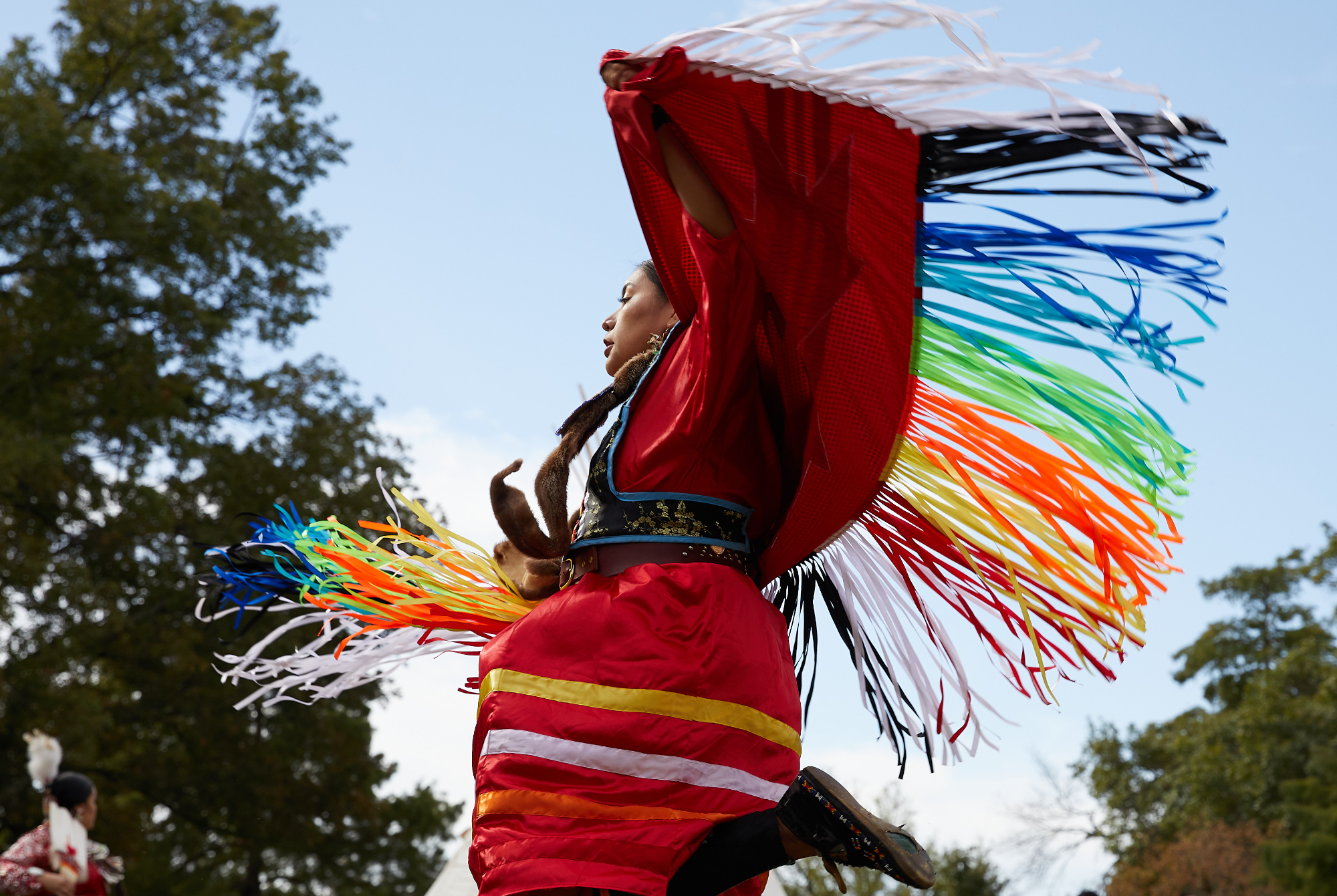 A woman dancing in a traditional outfit.