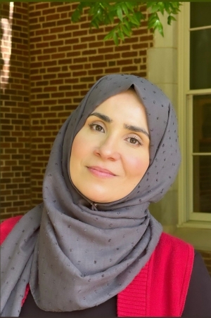 Mukarram Lillard, gray hijab, outside Farzaneh Hall