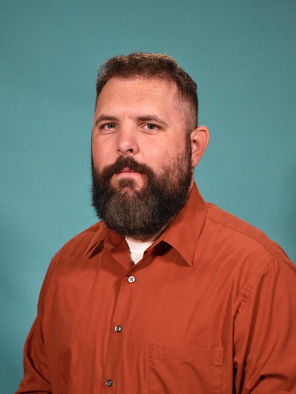 White silhouette icon on a crimson background.