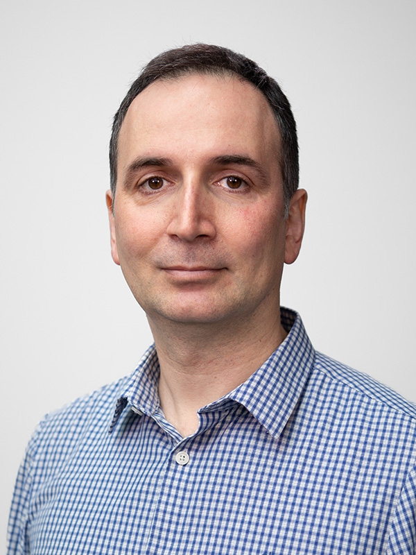 White silhouette icon on a crimson background.