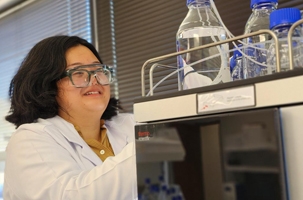 Student working with equipment in the Biomanufacturing Lab.