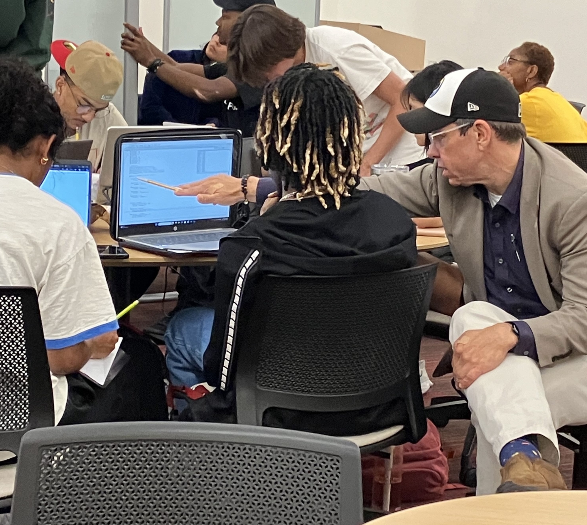 Student working with professor at study night.