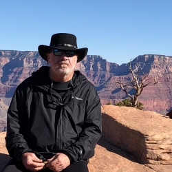 Robert Knox sits at the Grand Canyon