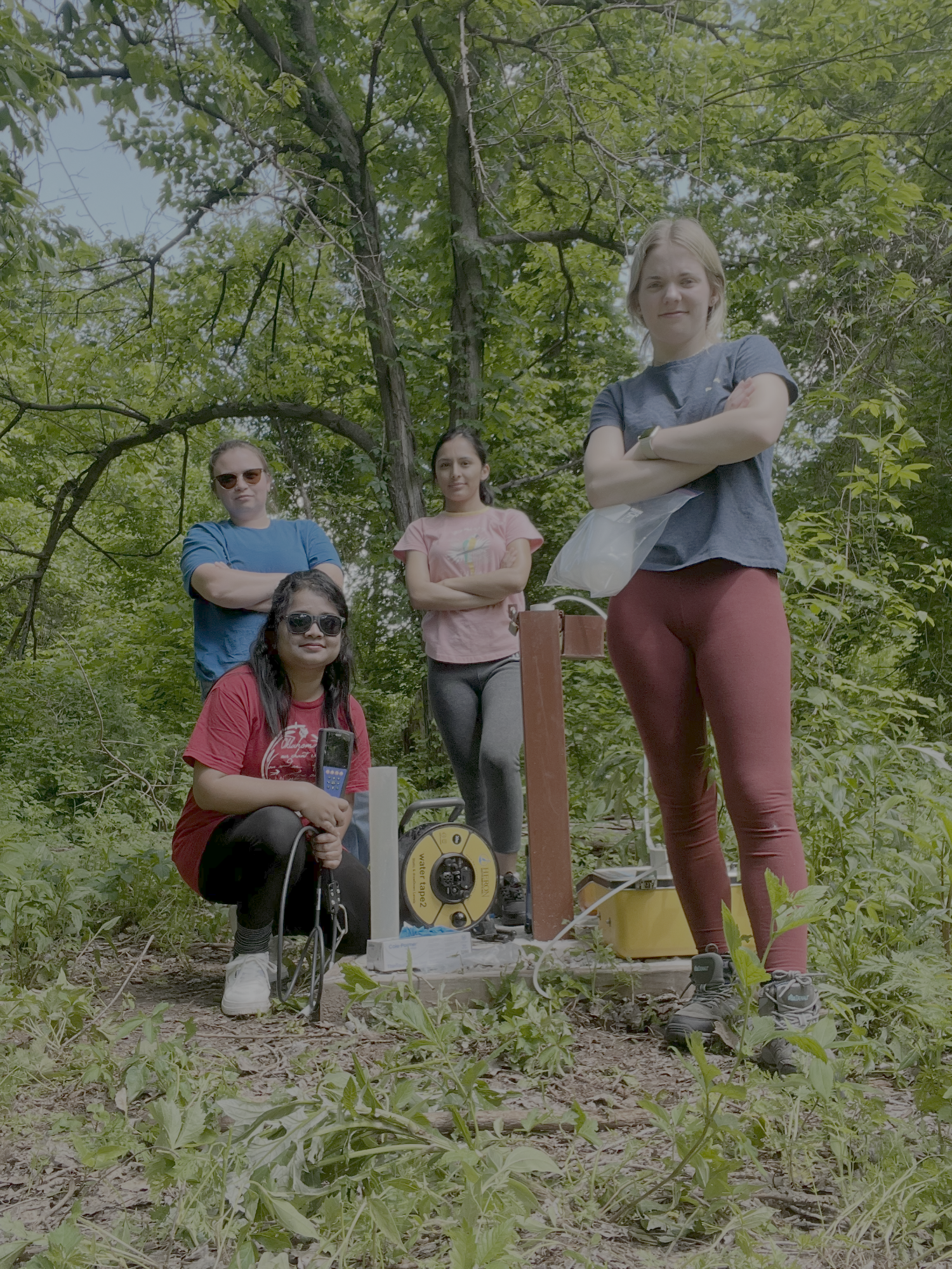 Sydney Nordquist standing next to landfill leachate collection well.