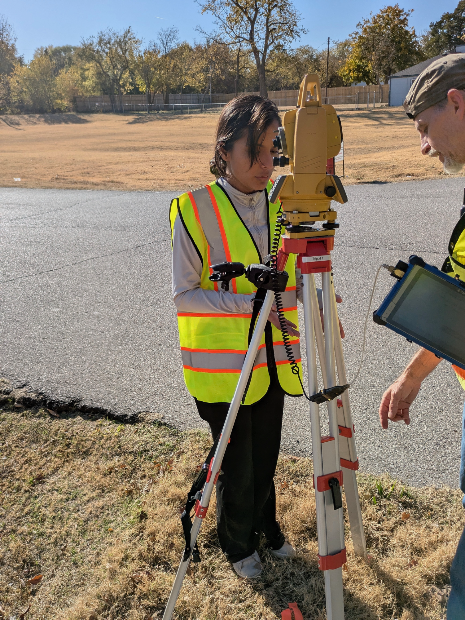Nitu Adhikari (left) and Nethmi Wickrama Gunarathne (right) taking GPS coordinates and tagging trees.