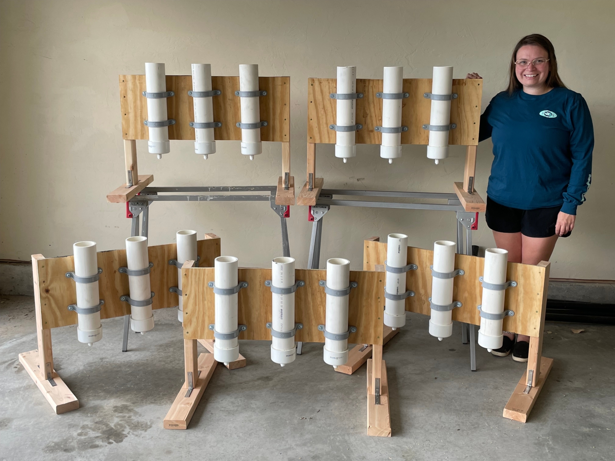 Jessica Burke standing next to her experimental columns.