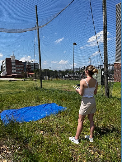 Lori Han flying a drone.