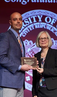 Dean Shehab Presenting Award to Student