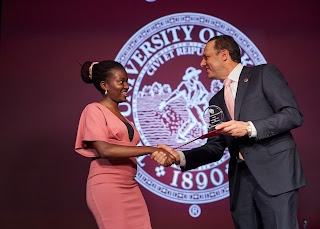 OU President Harroz Presenting Award to Student