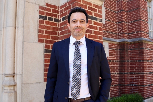 Pejman Kazempoor stands in front of Felgar Hall
